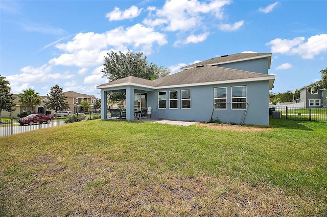 back of property featuring a fenced backyard, stucco siding, a patio, roof with shingles, and a lawn