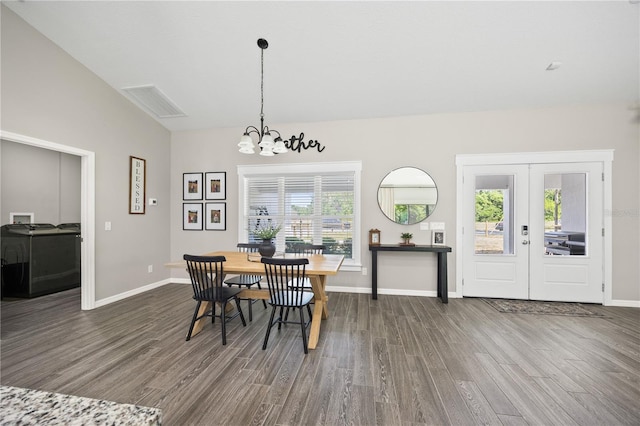 dining room with dark wood-style floors, a chandelier, visible vents, baseboards, and french doors