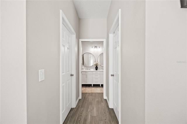 corridor with dark wood-type flooring