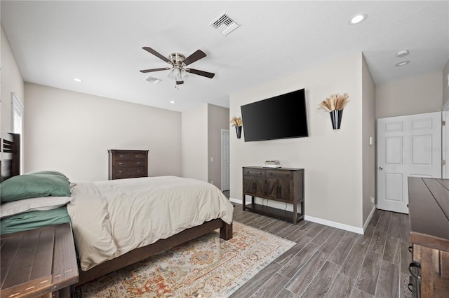 bedroom with recessed lighting, dark wood-type flooring, a ceiling fan, visible vents, and baseboards