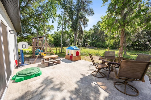 view of patio / terrace featuring fence and outdoor dining space