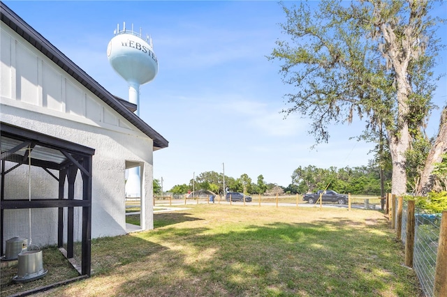 view of yard featuring fence and cooling unit
