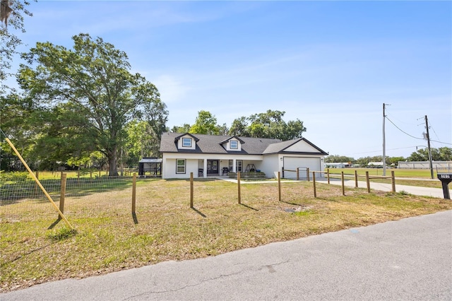 cape cod house with a porch, fence, a garage, driveway, and a front yard