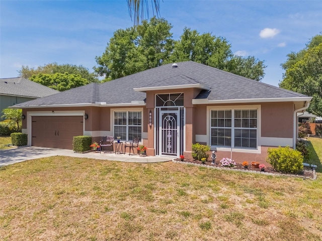 single story home with a front yard, stucco siding, an attached garage, and roof with shingles