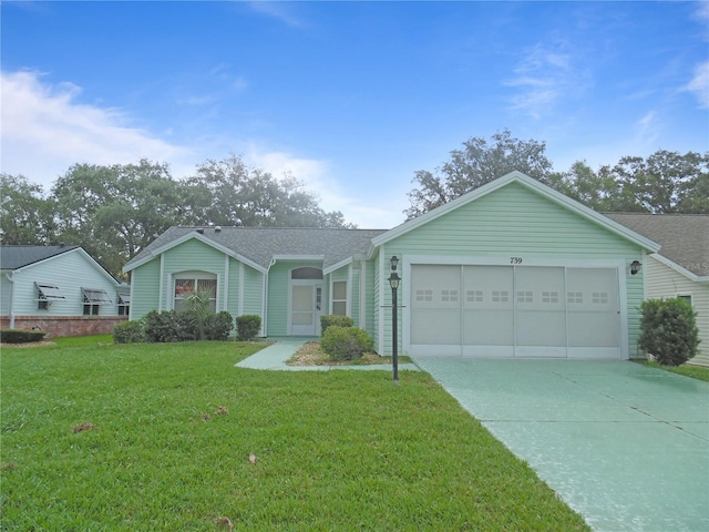 739 Cortez Ave, The Villages, FL 32159 - ranch-style home featuring a garage, driveway, a front yard, and roof with shingles