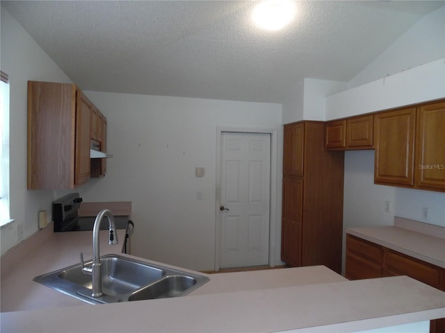739 Cortez Ave, The Villages, FL 32159 - kitchen with brown cabinetry, light countertops, a peninsula, range with electric cooktop, and a textured ceiling