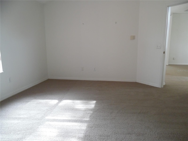 739 Cortez Ave, The Villages, FL 32159 - carpeted spare room with baseboards