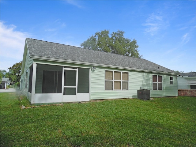739 Cortez Ave, The Villages, FL 32159 - back of house featuring a yard, roof with shingles, and a sunroom