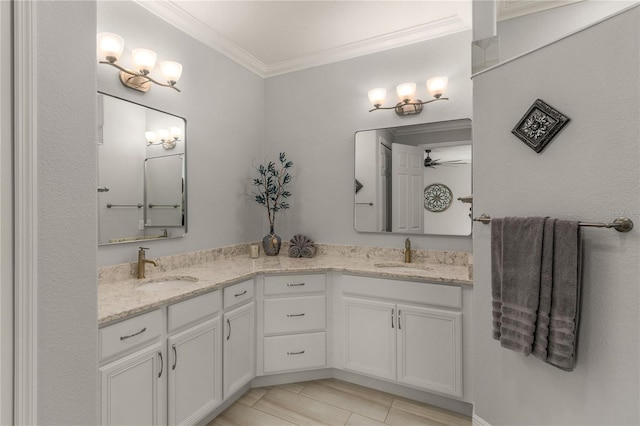 8492 Hartford Way, Mount Dora, FL 32757 - bathroom with double vanity, ornamental molding, a ceiling fan, and tile patterned flooring