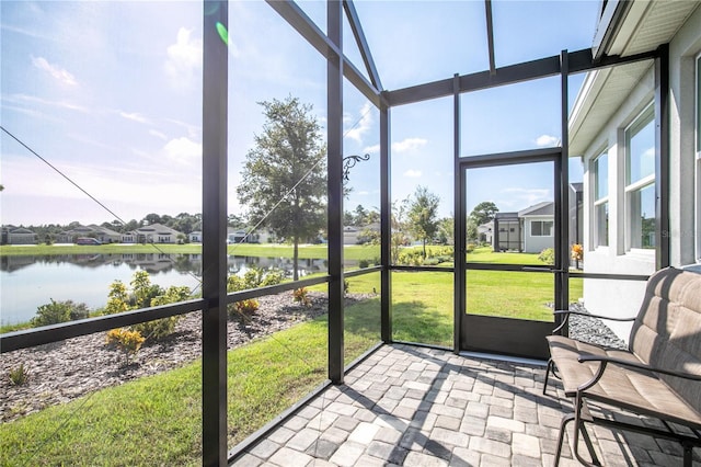 8492 Hartford Way, Mount Dora, FL 32757 - unfurnished sunroom with a water view