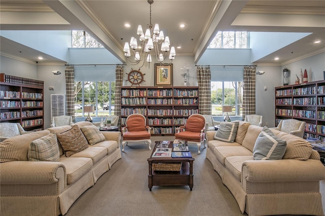8492 Hartford Way, Mount Dora, FL 32757 - living room featuring bookshelves, crown molding, a high ceiling, recessed lighting, and a chandelier