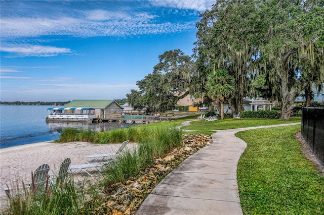 8492 Hartford Way, Mount Dora, FL 32757 - dock with a water view and a lawn