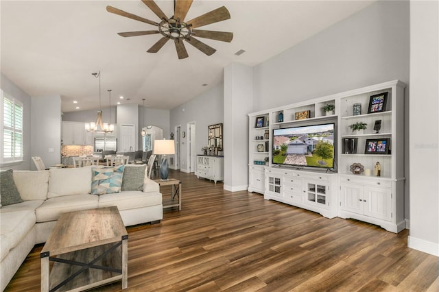8492 Hartford Way, Mount Dora, FL 32757 - living room with vaulted ceiling, a chandelier, dark wood finished floors, a ceiling fan, and recessed lighting