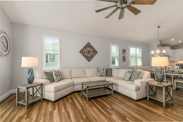 8492 Hartford Way, Mount Dora, FL 32757 - living area with wood finished floors, a ceiling fan, lofted ceiling, a chandelier, and recessed lighting