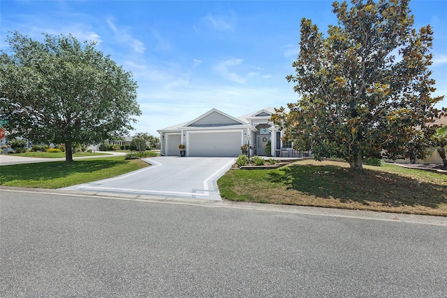1140 Eureka Mill Run, The Villages, FL 32162 - view of front facade featuring an attached garage, concrete driveway, and a front lawn