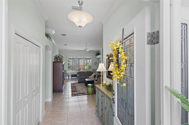 1140 Eureka Mill Run, The Villages, FL 32162 - hall with visible vents, baseboards, light tile patterned flooring, and ornamental molding