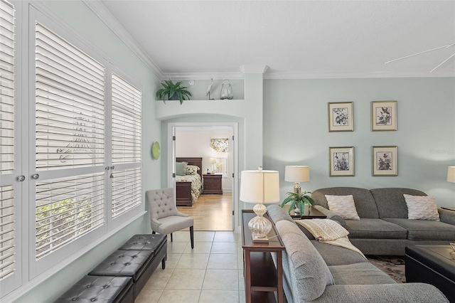 1140 Eureka Mill Run, The Villages, FL 32162 - living area with crown molding, light tile patterned floors, and attic access