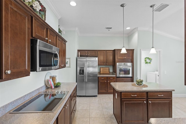 1140 Eureka Mill Run, The Villages, FL 32162 - kitchen with pendant lighting, light tile patterned floors, visible vents, and appliances with stainless steel finishes