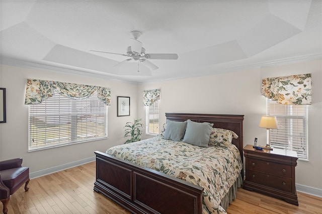 1140 Eureka Mill Run, The Villages, FL 32162 - bedroom with baseboards, ornamental molding, light wood finished floors, and a ceiling fan
