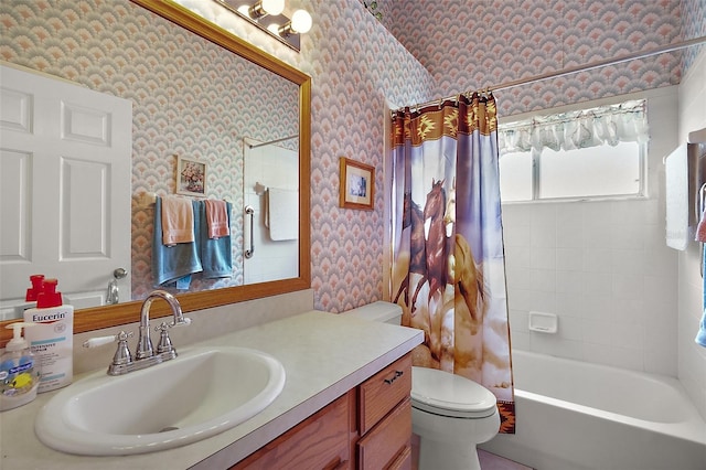 bathroom with wallpapered walls, shower / bath combination with curtain, toilet, and vanity