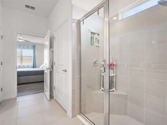 full bathroom with connected bathroom, a stall shower, a ceiling fan, visible vents, and tile patterned flooring