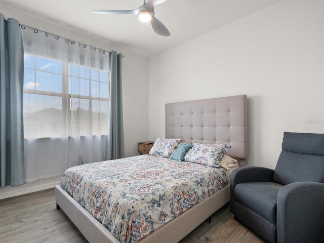 bedroom featuring wood finished floors and ceiling fan