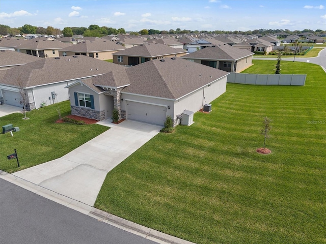 birds eye view of property with a residential view