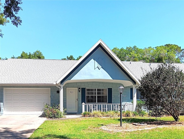 single story home featuring covered porch, a shingled roof, concrete driveway, and an attached garage