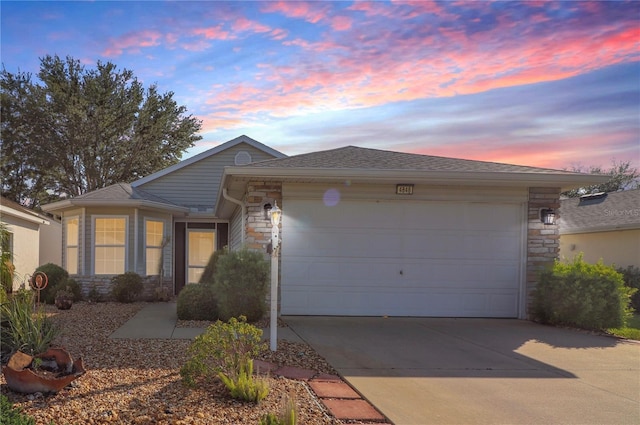 4848 Saint Andrews Arc, Leesburg, FL 34748 - single story home featuring concrete driveway, an attached garage, and stone siding