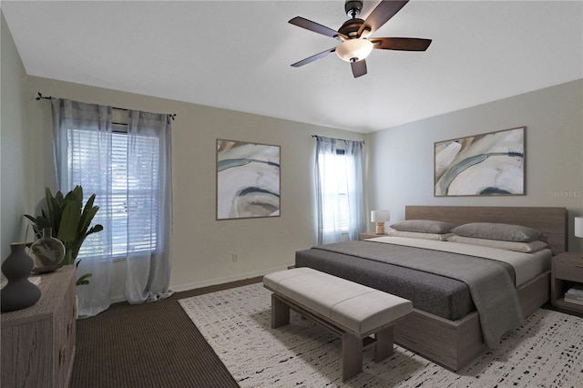 4848 Saint Andrews Arc, Leesburg, FL 34748 - bedroom with baseboards, ceiling fan, and light colored carpet