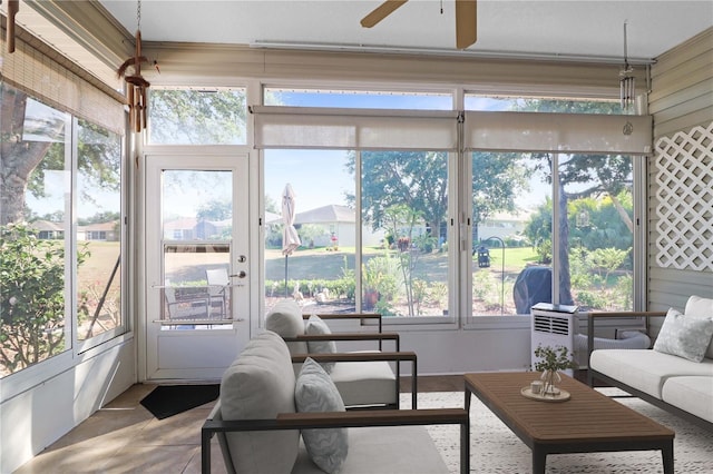 4848 Saint Andrews Arc, Leesburg, FL 34748 - sunroom / solarium featuring tile patterned floors, a ceiling fan, and outdoor lounge area