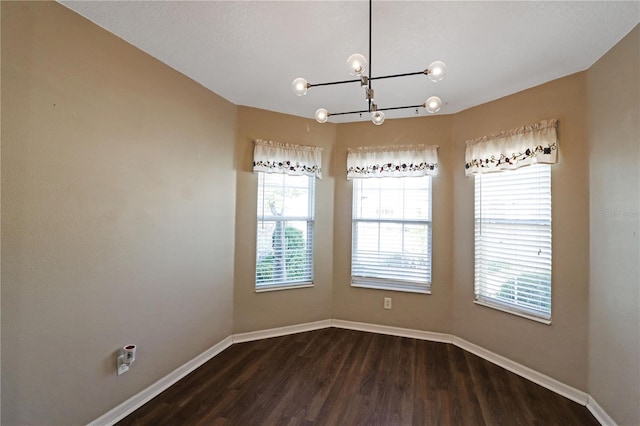 4848 Saint Andrews Arc, Leesburg, FL 34748 - unfurnished dining area featuring baseboards, a notable chandelier, and dark wood-style floors