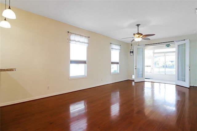 4848 Saint Andrews Arc, Leesburg, FL 34748 - unfurnished room with a ceiling fan, hardwood / wood-style floors, and baseboards