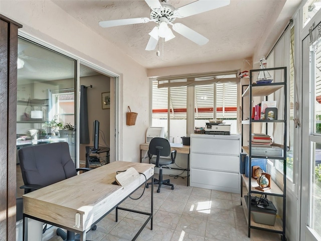 office area with ceiling fan and a wealth of natural light
