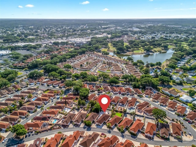 drone / aerial view with a water view and a residential view