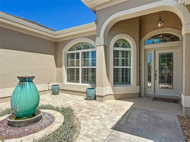 1842 Lake Ridge Dr, The Villages, FL 32162 - doorway to property featuring stucco siding