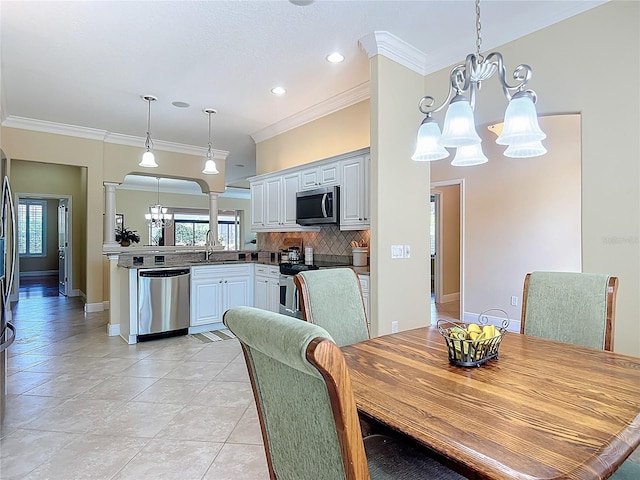 1842 Lake Ridge Dr, The Villages, FL 32162 - dining room with ornamental molding, baseboards, recessed lighting, light tile patterned floors, and a notable chandelier