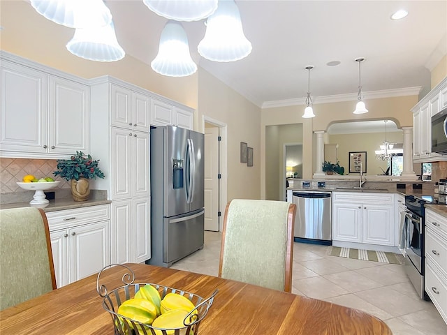1842 Lake Ridge Dr, The Villages, FL 32162 - kitchen featuring light tile patterned flooring, a sink, stainless steel appliances, white cabinetry, and decorative backsplash