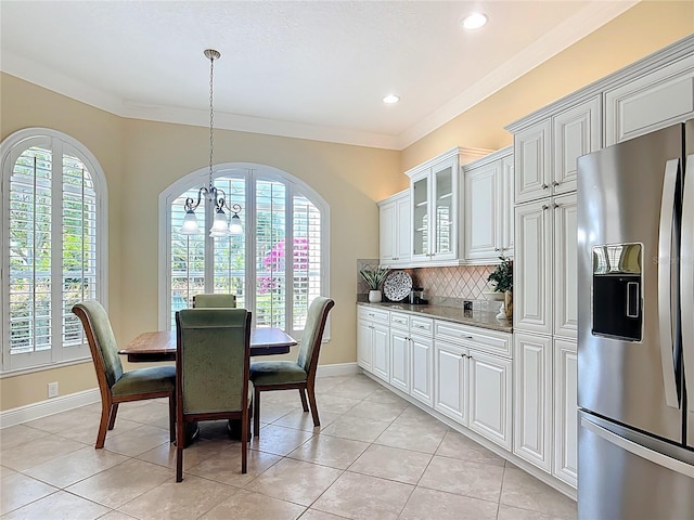 1842 Lake Ridge Dr, The Villages, FL 32162 - dining area with light tile patterned floors, baseboards, recessed lighting, and a chandelier