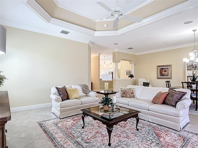 1842 Lake Ridge Dr, The Villages, FL 32162 - living room featuring visible vents, ornamental molding, baseboards, and ceiling fan with notable chandelier