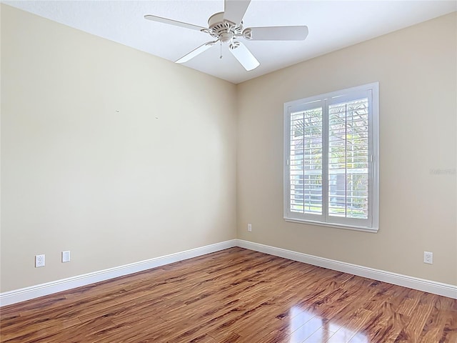 1842 Lake Ridge Dr, The Villages, FL 32162 - unfurnished room with a ceiling fan, baseboards, and wood finished floors