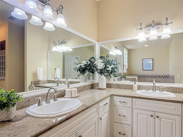 1842 Lake Ridge Dr, The Villages, FL 32162 - bathroom featuring double vanity, a sink, and a notable chandelier