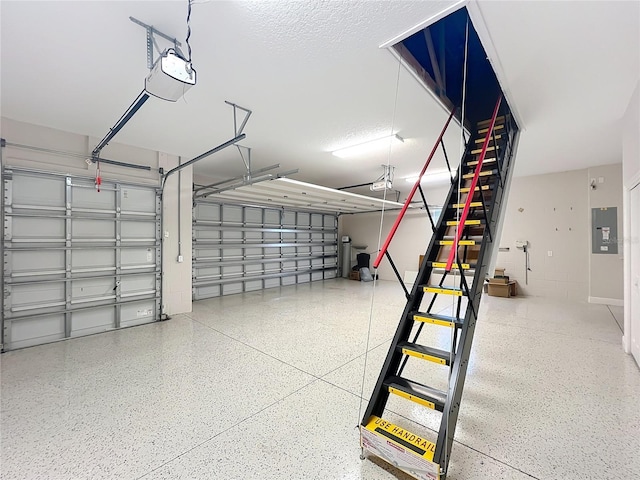 1842 Lake Ridge Dr, The Villages, FL 32162 - garage featuring a garage door opener and electric panel