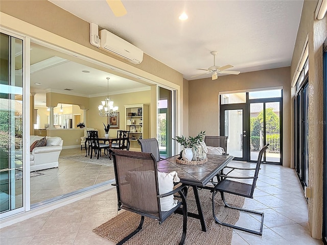 1842 Lake Ridge Dr, The Villages, FL 32162 - dining space with a wall mounted air conditioner, baseboards, ceiling fan with notable chandelier, ornate columns, and light tile patterned flooring