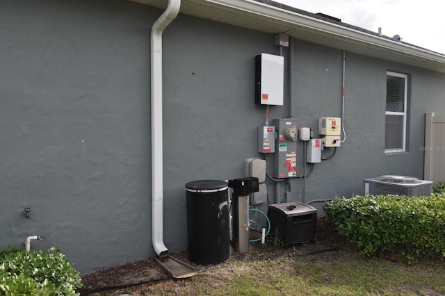 709 Calabria Way, Howey In The Hills, FL 34737 - view of property exterior with stucco siding and cooling unit
