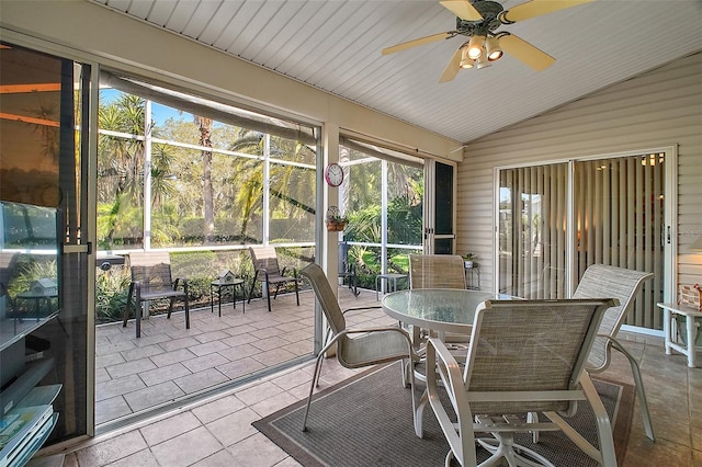sunroom featuring ceiling fan and outdoor dining area