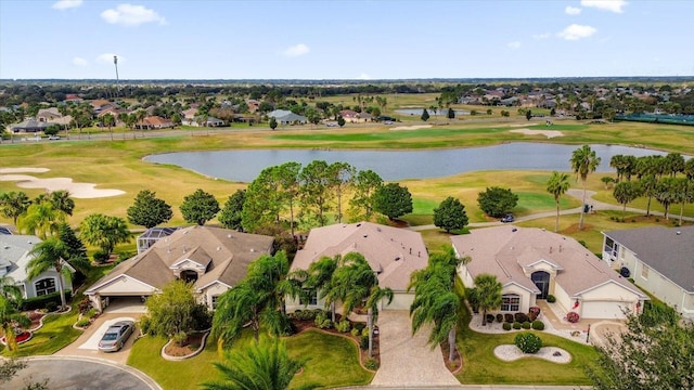 drone / aerial view featuring a residential view, a water view, and view of golf course