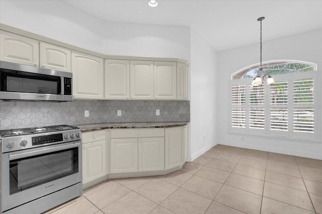 kitchen with stainless steel appliances, light tile patterned floors, backsplash, pendant lighting, and stone countertops