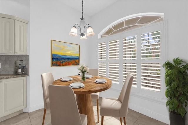 dining area featuring light tile patterned floors, an inviting chandelier, and a wealth of natural light
