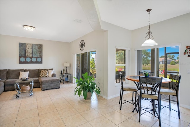 2641 Meadow View Ct, Kissimmee, FL 34746 - dining room featuring light tile patterned floors and baseboards